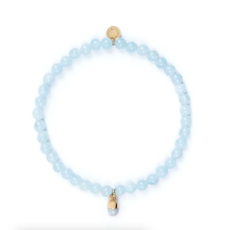 4mm Aquamarine Bead Bracelet with Blue Pill Charm sold by Stone and Mason