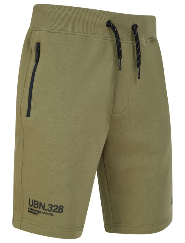 Pepys Brushback Fleece Jogger Shorts with Zip Pockets in Deep Lichen Green - Dissident sold by Tokyo Laundry