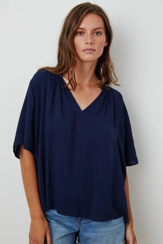 JAYCEE SPLIT NECK BLOUSE IN POSTMAN sold by Velvet Tees