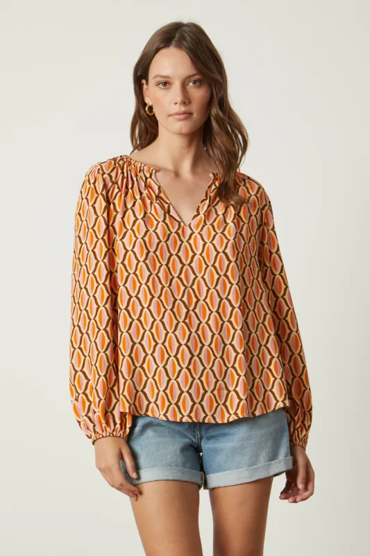 LAURA GEO PRINT CREPE TOP IN ORANGE sold by Velvet Tees