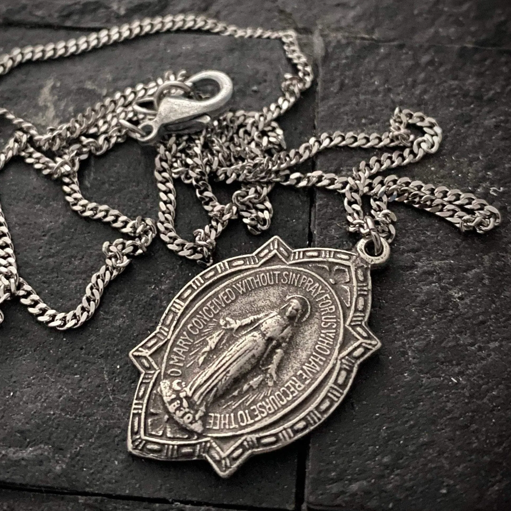 Men's Miraculous Medal featuring a depiction of the Blessed Mother, Steel chain necklace, 20 or 24 inches, ST-009 sold by Vintage Gentlemen