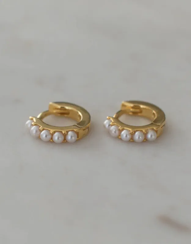Mini Pearl Huggie Gold Earrings sold by White & Co