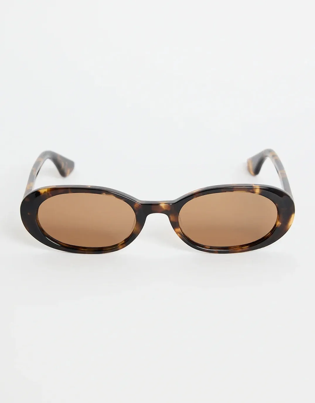 Sydney Narrow Oval Sunglasses - Tort sold by White & Co