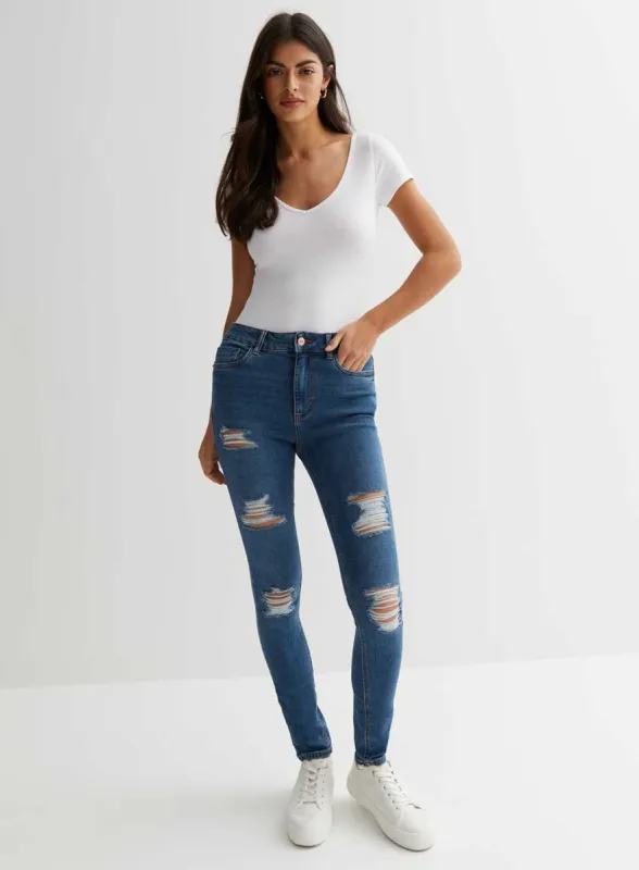 Ladies Blue Ripped Mid Rise Skinny Jeans sold by Your Style Outlet