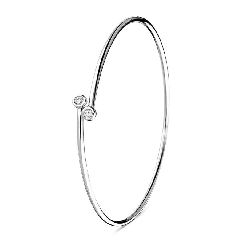 18ct White Gold 0.10ct Diamond Tube Set Crossover Bangle sold by Jura Watches
