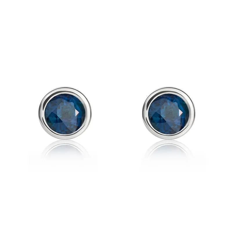 9ct White Gold Sapphire 4mm Round Rub Over Set Stud Earrings sold by Jura Watches