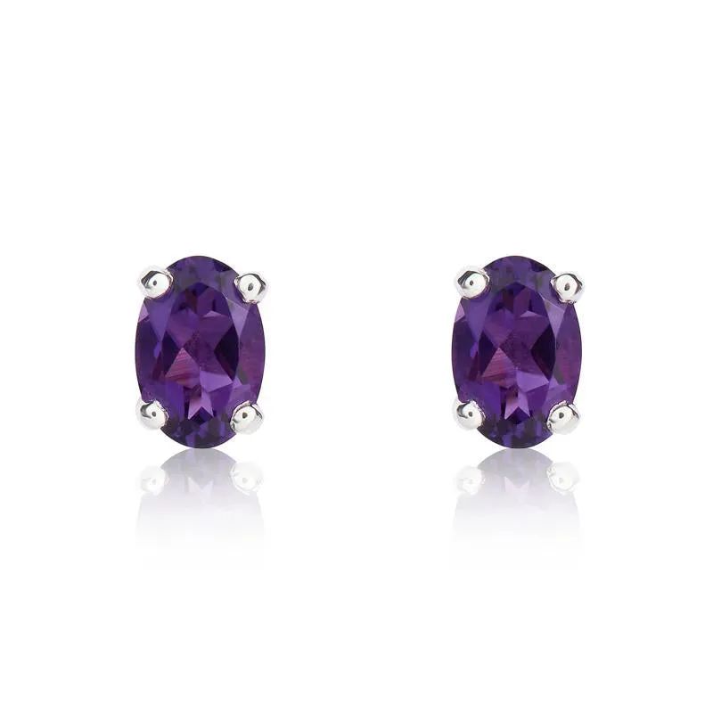 9ct White Gold Amethyst 6x4mm Oval Claw Set Stud Earrings sold by Jura Watches