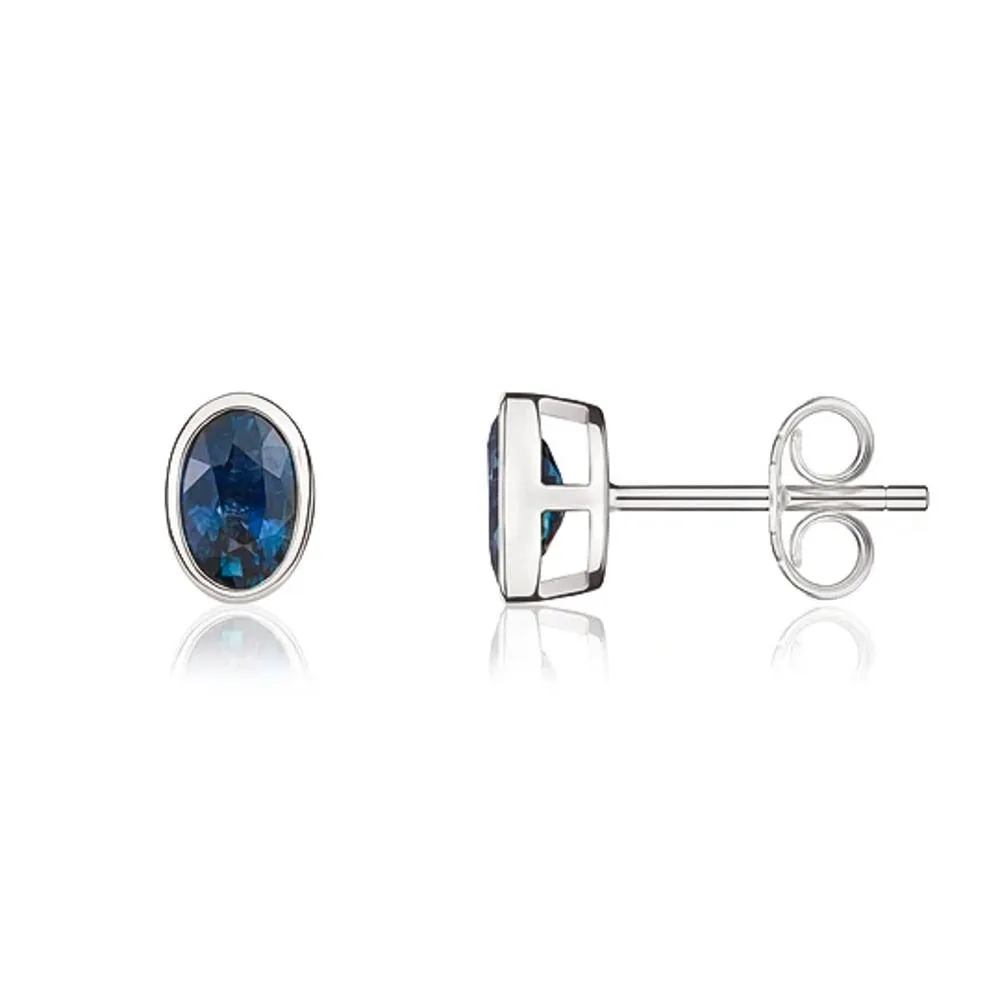 9ct White Gold Sapphire 6x4mm Oval Rub Over Set Stud Earrings sold by Jura Watches product image thumbnail 2