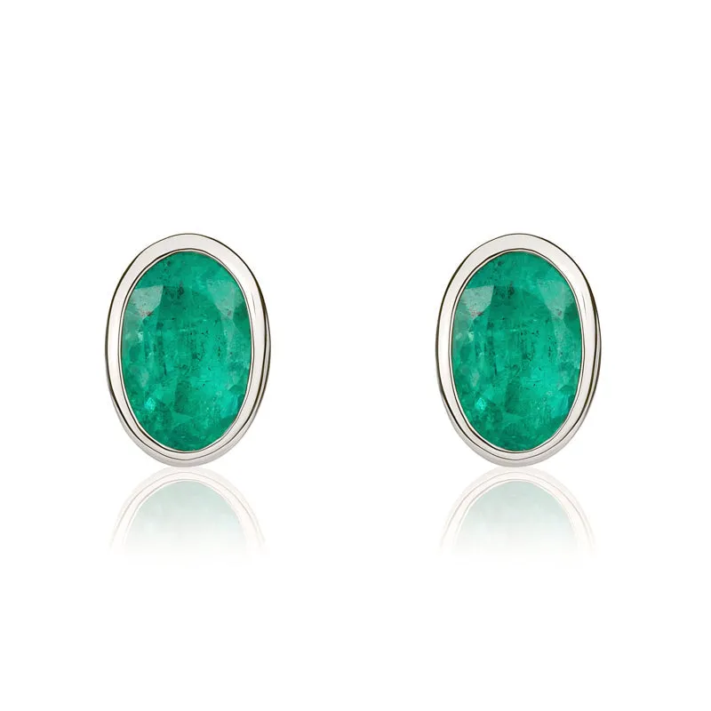 9ct White Gold Emerald 6x4mm Oval Rub Over Set Stud Earrings sold by Jura Watches