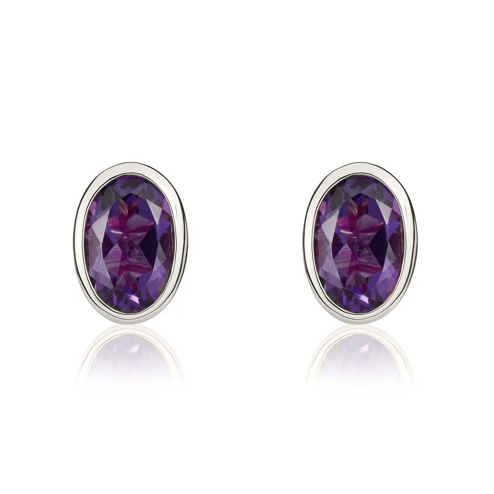 9ct White Gold Amethyst 6x4mm Oval Rub Over Set Stud Earrings sold by Jura Watches