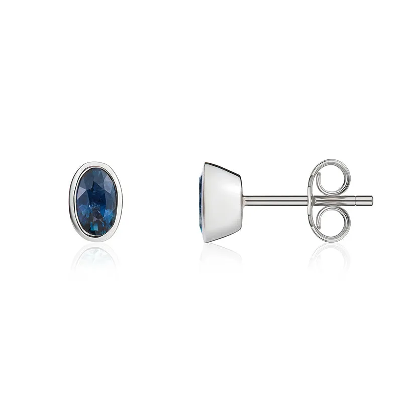 9ct White Gold Sapphire 5x3mm Oval Rub Over Set Stud Earrings sold by Jura Watches product image thumbnail 2