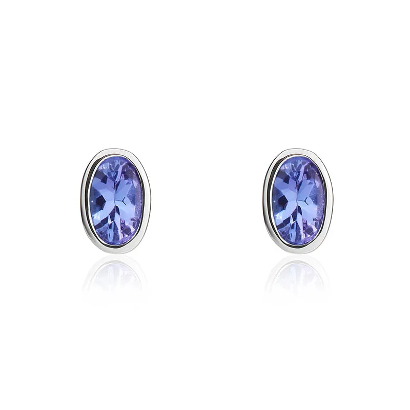 9ct White Gold Tanzanite 5x3mm Oval Rub Over Set Stud Earrings sold by Jura Watches