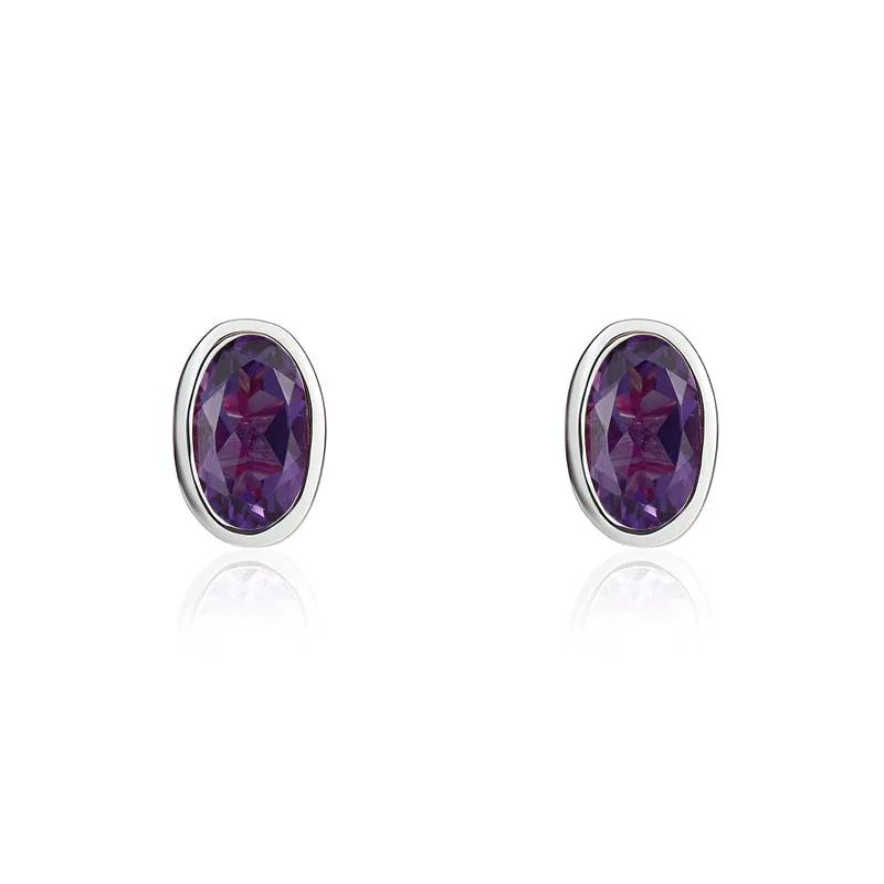 9ct White Gold Amethyst 5x3mm Oval Rub Over Set Stud Earrings sold by Jura Watches