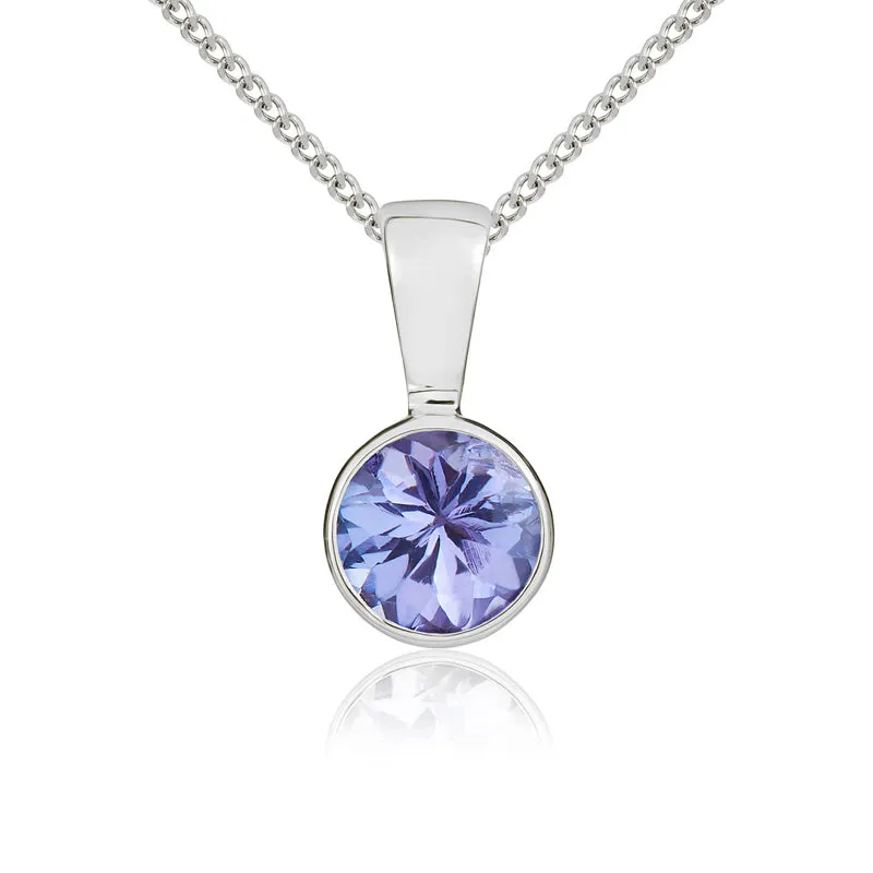9ct White Gold Tanzanite 5mm Round Rub Over Set Pendant sold by Jura Watches