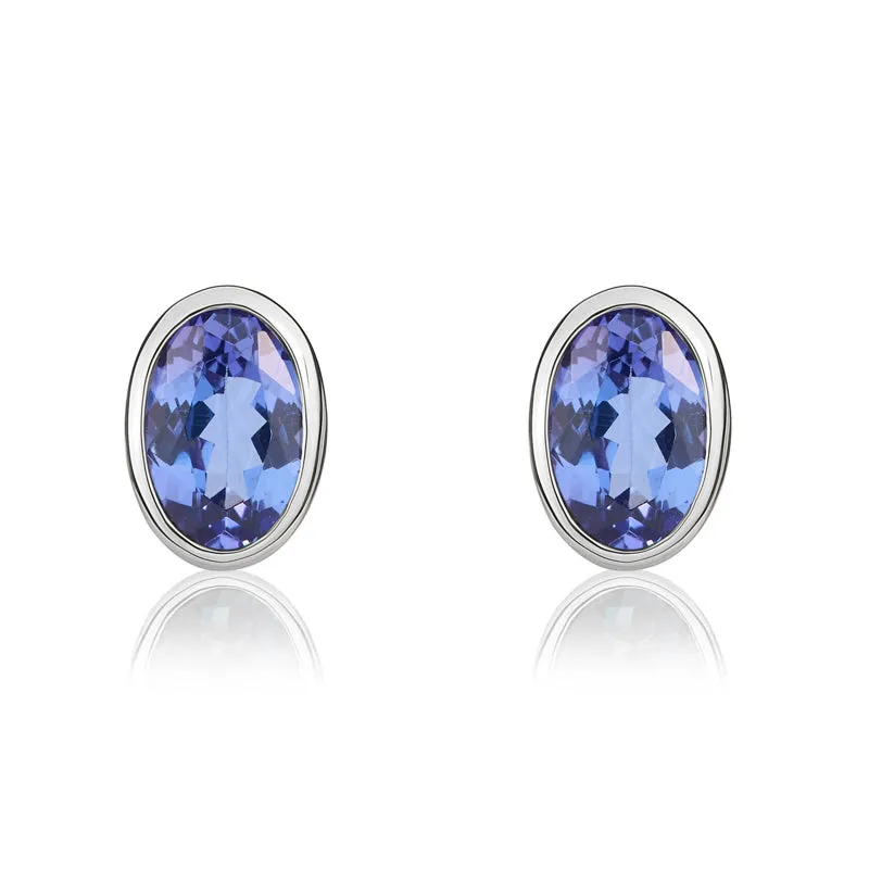 9ct White Gold Tanzanite 6x4mm Oval Rub Over Set Stud Earrings sold by Jura Watches