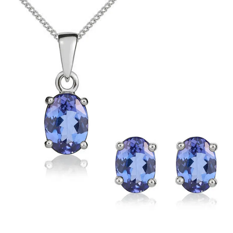 9ct White Gold Tanzanite 7x5mm Oval Claw Set Pendant and Stud Earrings Set sold by Jura Watches