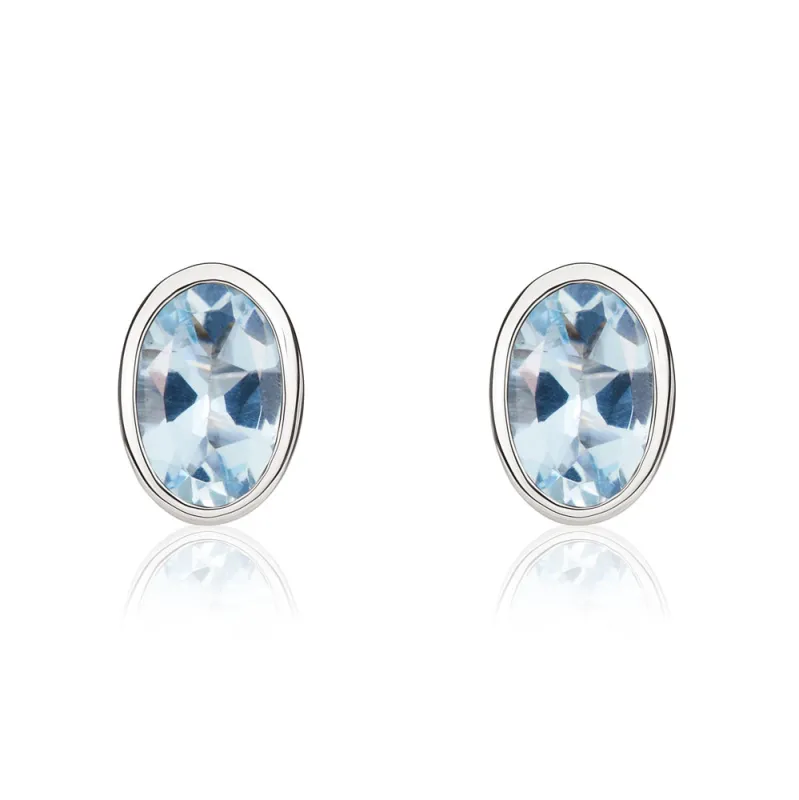 9ct White Gold Aquamarine 6x4mm Oval Rub Over Set Stud Earrings sold by Jura Watches