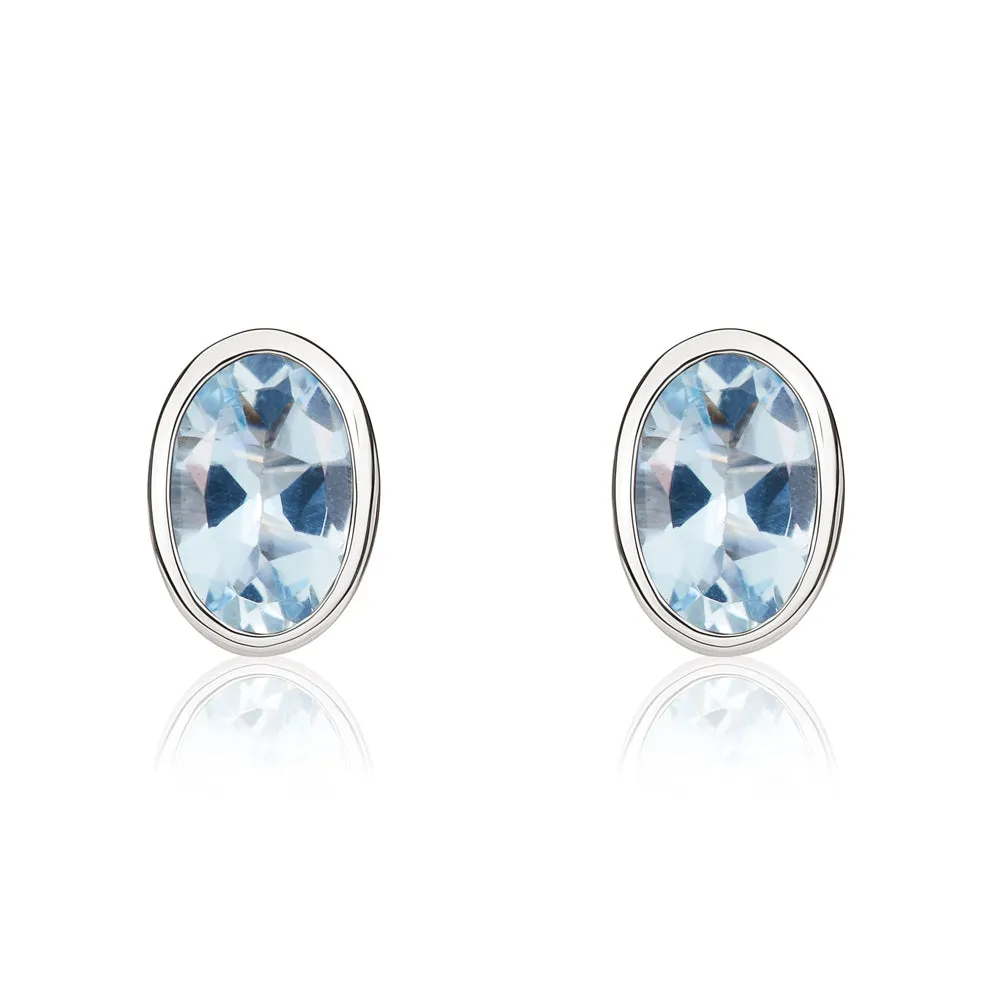 9ct White Gold Aquamarine 6x4mm Oval Rub Over Set Stud Earrings sold by Jura Watches