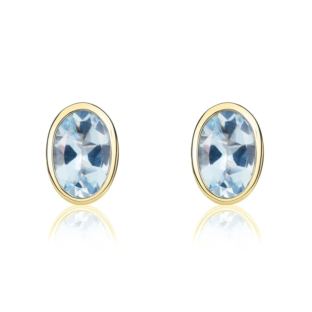 9ct Yellow Gold Aquamarine 6x4mm Oval Rub Over Set Stud Earrings sold by Jura Watches