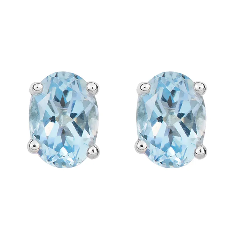 9ct White Gold Aquamarine 7x5mm Oval Claw Set Stud Earrings sold by Jura Watches