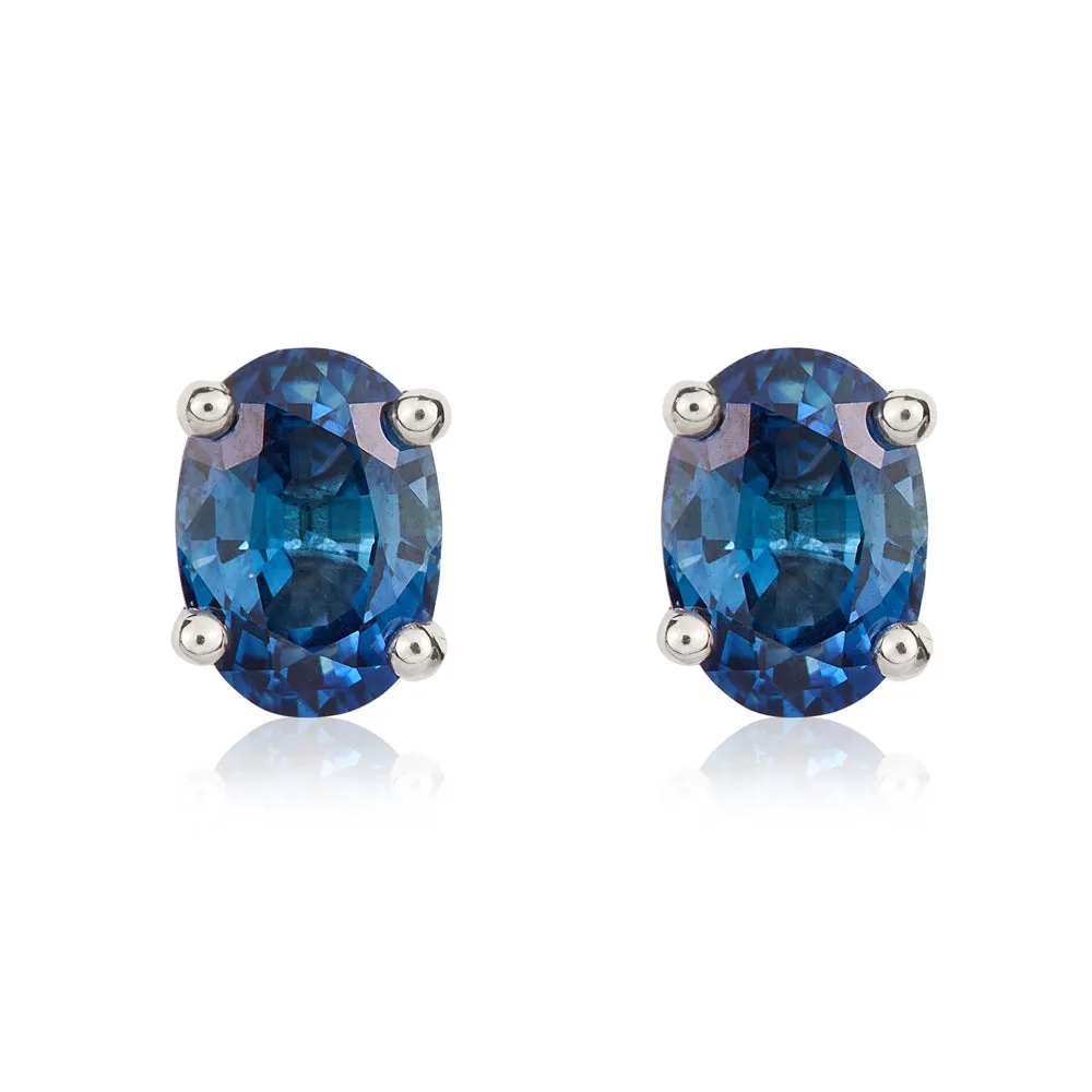 9ct White Gold Sapphire 7x5mm Oval Claw Set Stud Earrings sold by Jura Watches