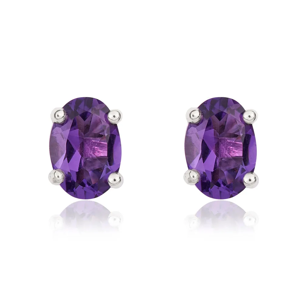 9ct White Gold Amethyst 7x5mm Oval Claw Set Stud Earrings sold by Jura Watches