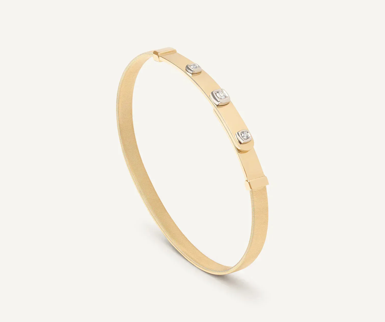 Marco Bicego Masai 18ct Yellow Gold Thin Coil 0.10ct Diamond Bangle sold by Jura Watches