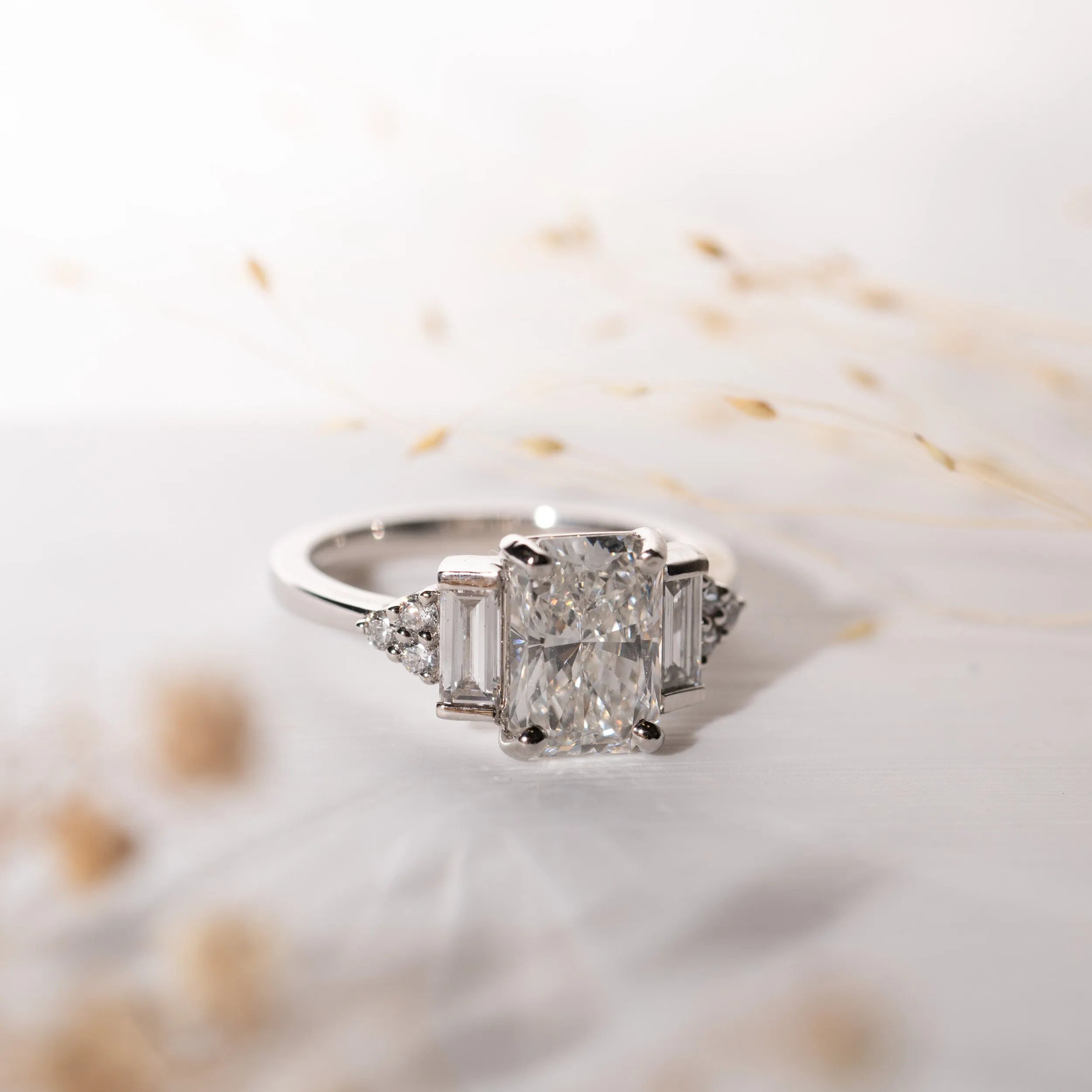 The Amber Ring | Emerald Cut Moissanite & Diamond Art Deco Accented Engagement sold by Ethica Diamonds