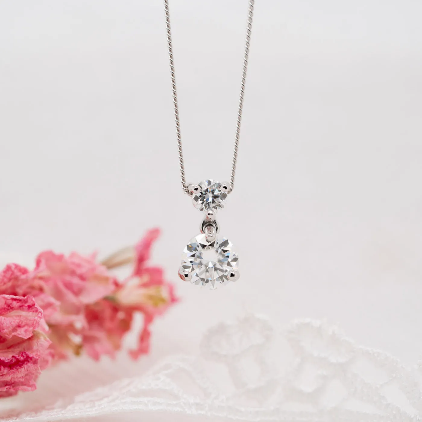The Maia Pendant | Round Moissanite Hourglass Drop sold by Ethica Diamonds