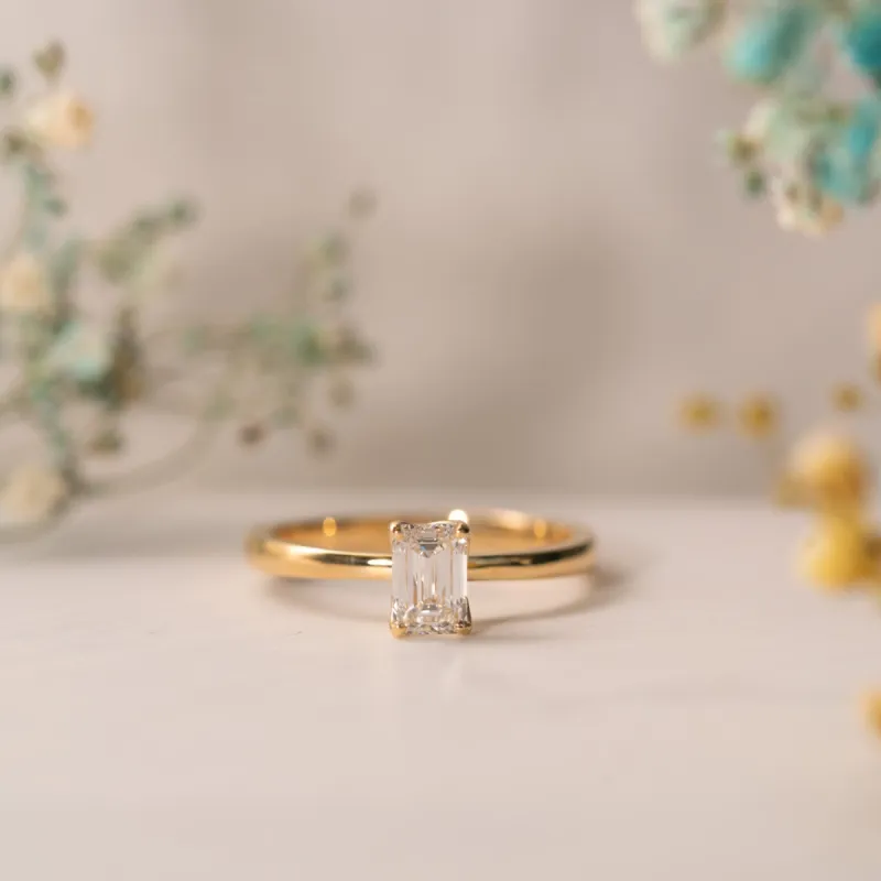 The India Ring | Emerald Cut Moissanite Dainty Engagement Solitaire sold by Ethica Diamonds