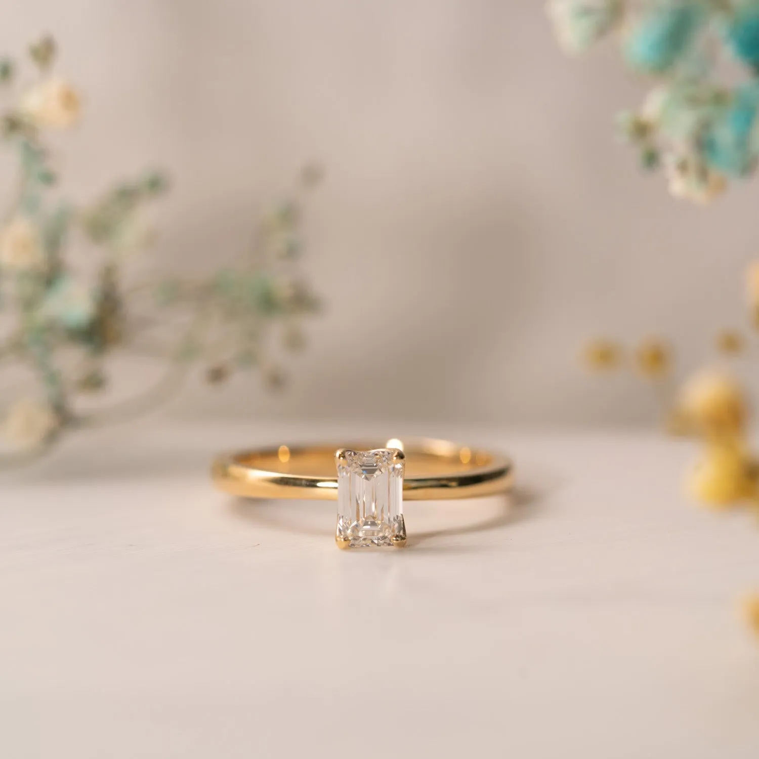 The India Ring | Emerald Cut Moissanite Dainty Engagement Solitaire sold by Ethica Diamonds