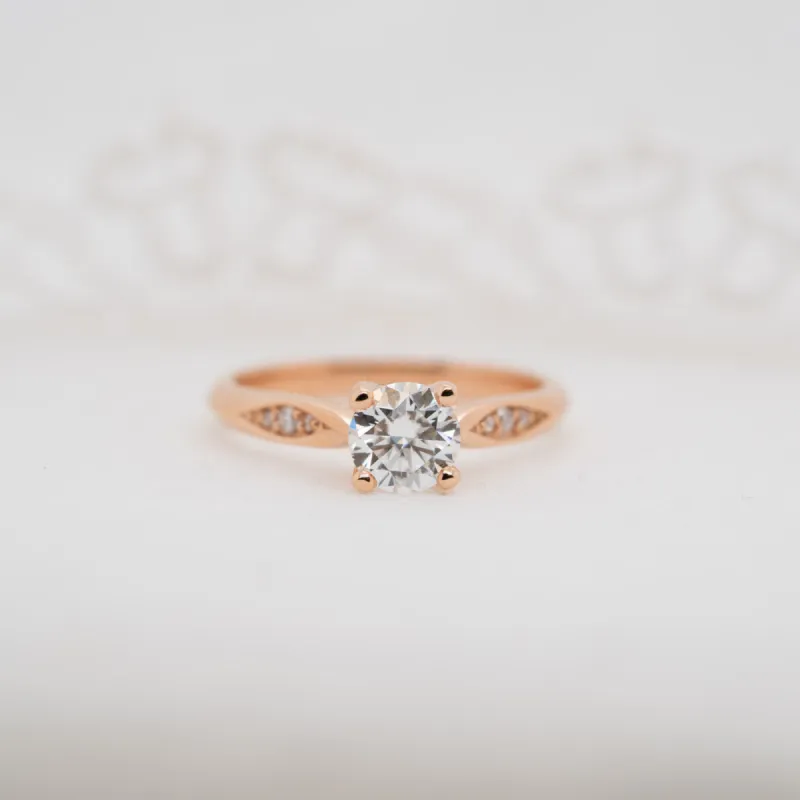 The Celia Ring | Round Moissanite & Diamond Four Prong Accented Engagement Solitaire sold by Ethica Diamonds