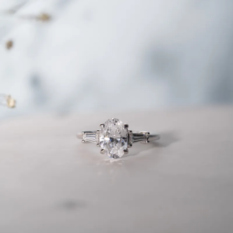 The Aurora | Lab Diamond Oval & Tapered Baguette Cut Engagement Trilogy Ring sold by Ethica Diamonds