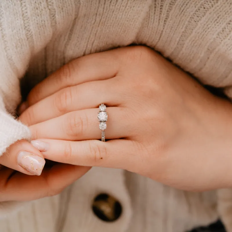The Nouveau Ring | Moissanite & Diamond Shoulder Set Engagement Trilogy sold by Ethica Diamonds