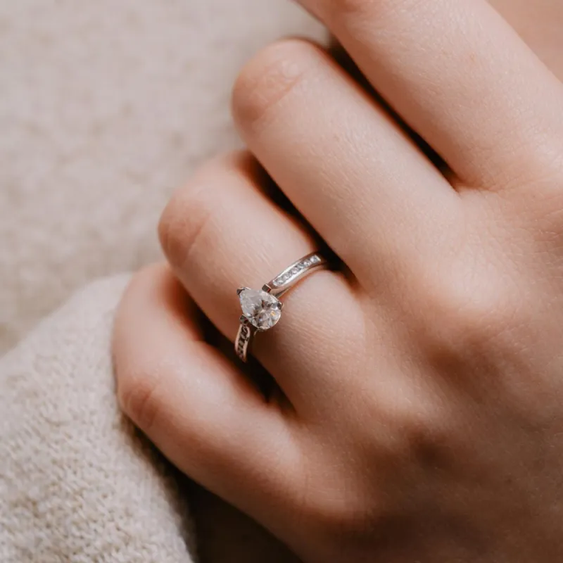 The Irene Ring | Pear Cut Moissanite & Diamond Channel Set Engagement sold by Ethica Diamonds