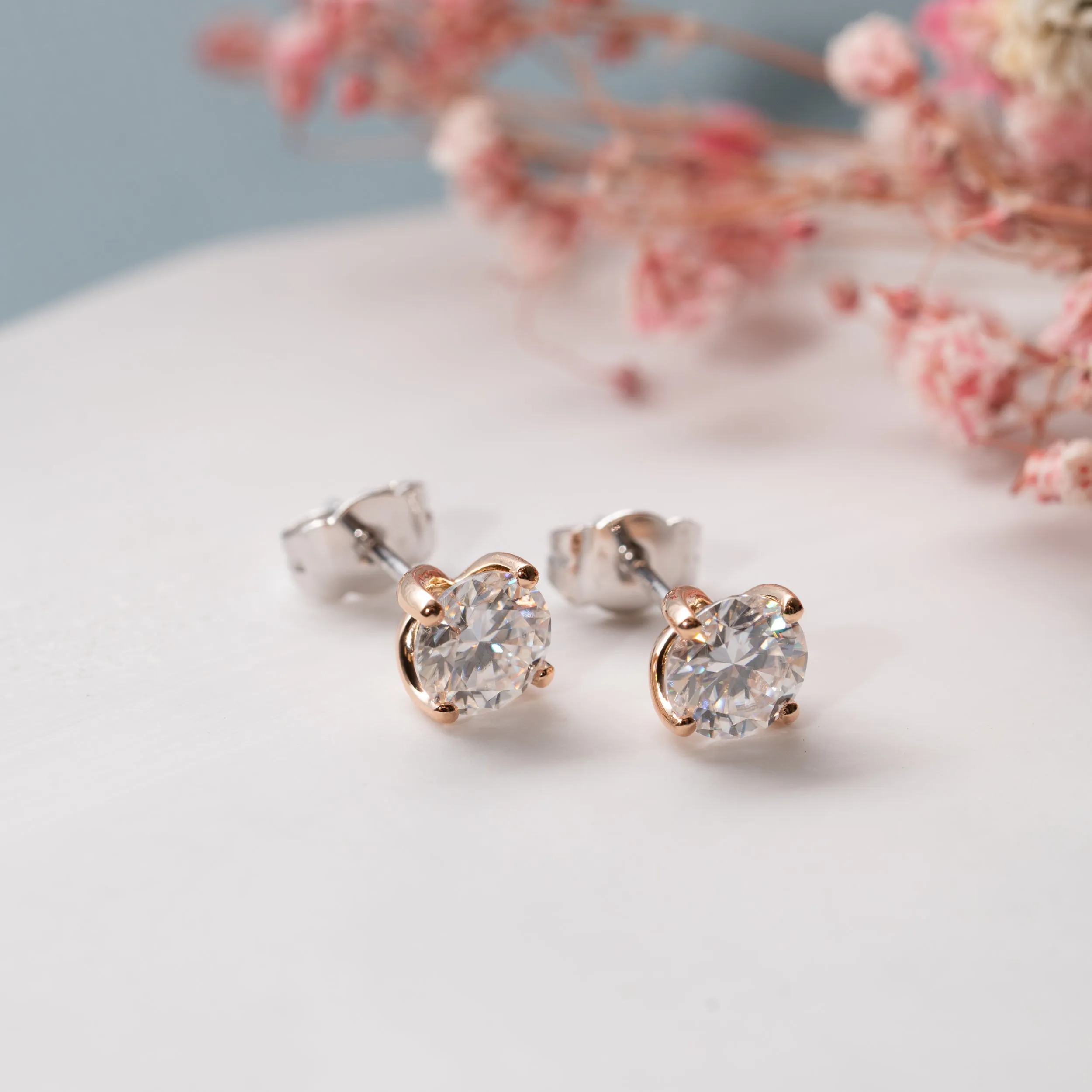 The Aria Earrings | Round Moissanite Twist Four Claw Solitaire Studs sold by Ethica Diamonds product image thumbnail 2