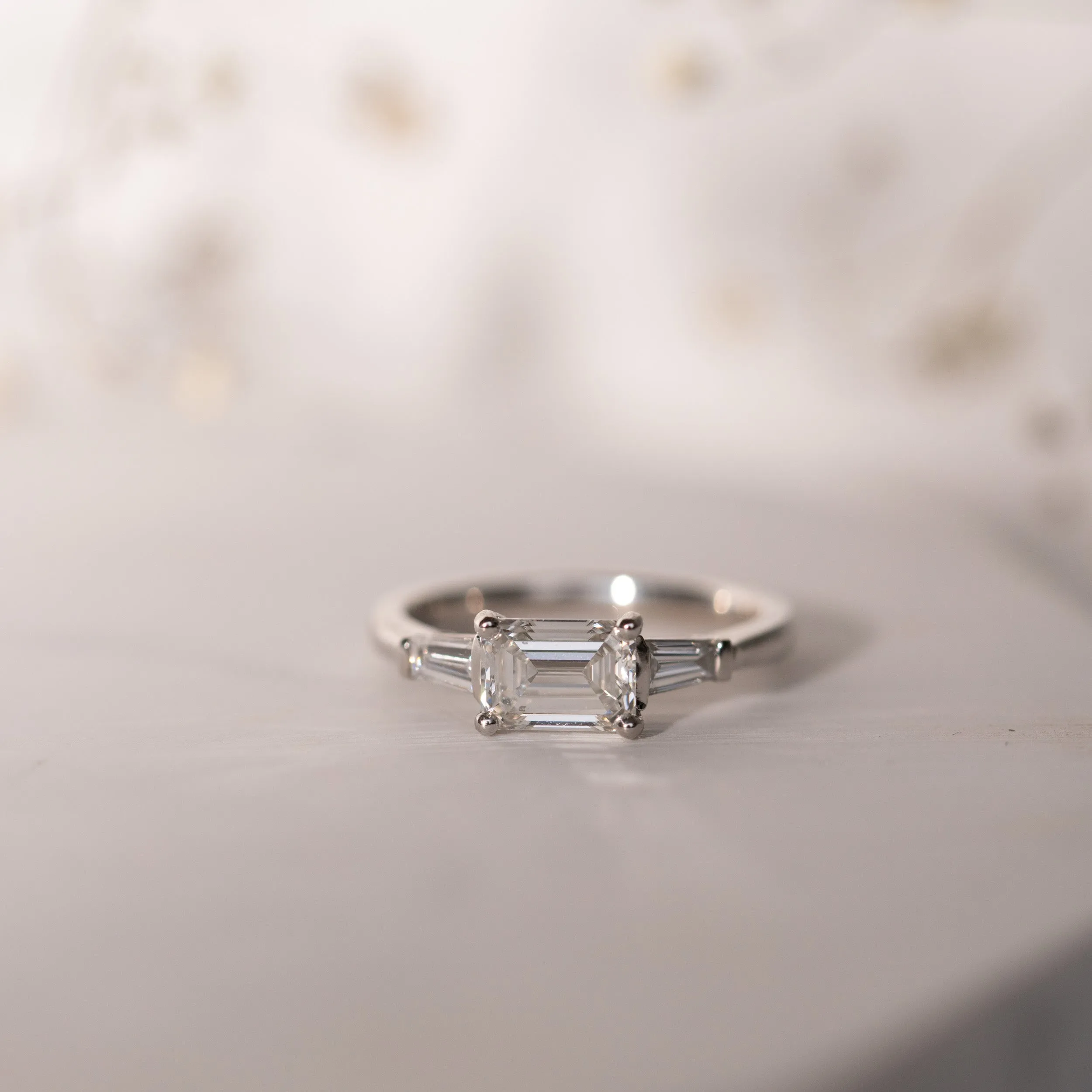 The Eden Ring | Moissanite Emerald & Baguette Engagement Trilogy sold by Ethica Diamonds