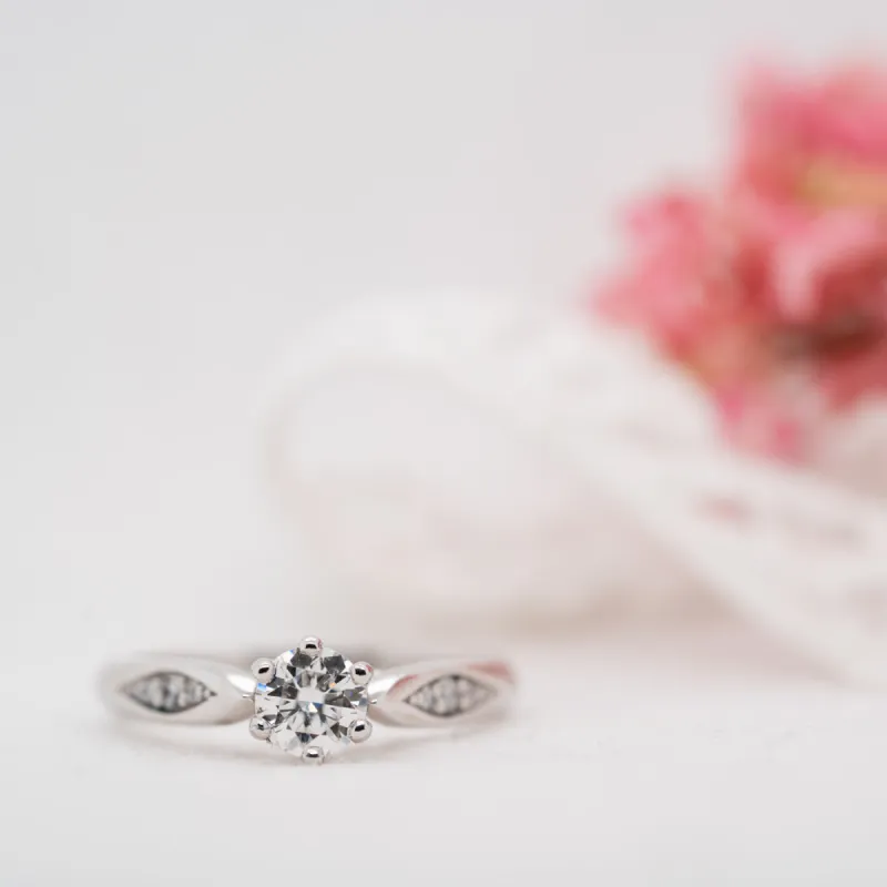 The Celia Ring | Round Moissanite & Diamond Six Prong Accented Engagement sold by Ethica Diamonds