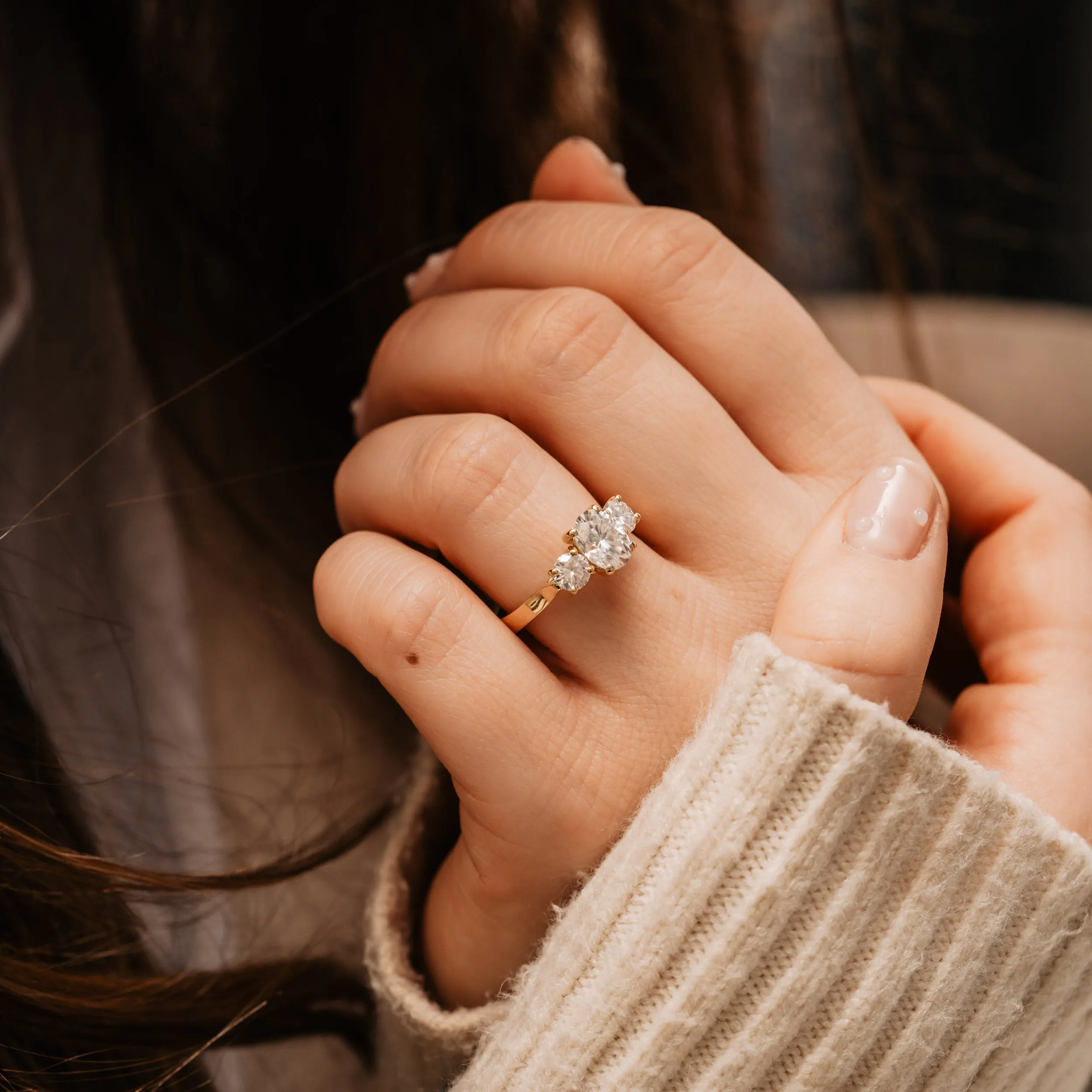 The Tessa Ring | Moissanite Oval & Round Graduated Engagement Trilogy sold by Ethica Diamonds