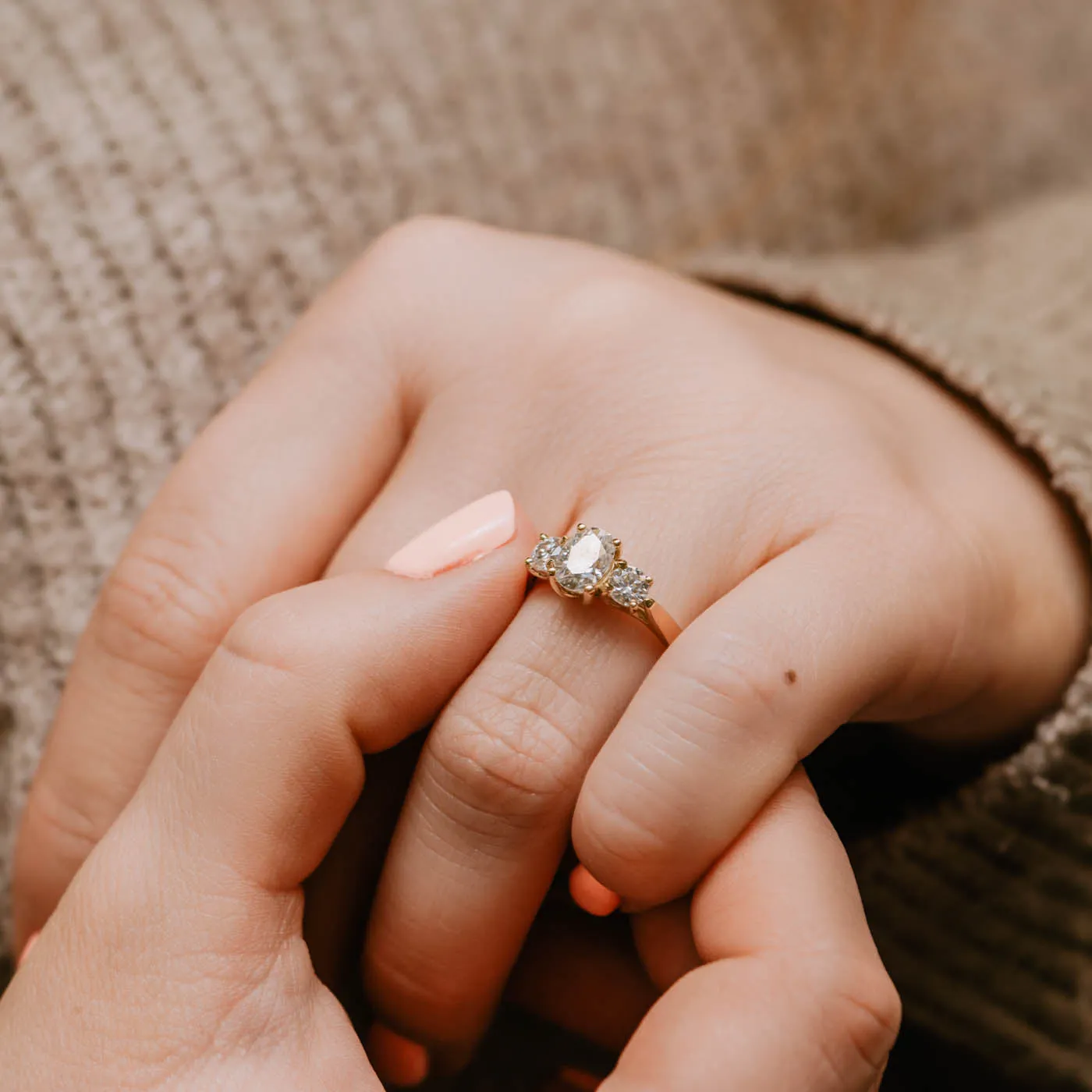 The Tessa Ring | Moissanite Oval & Round Graduated Engagement Trilogy sold by Ethica Diamonds product image thumbnail 4
