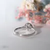 The Posey Ring | Moissanite & Diamond Floral Engagement Halo sold by Ethica Diamonds