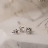 The Aria Earrings | 1.52ct D VVS2 Round Lab Diamond Twist Four Claw Solitaire 18k Gold sold by Ethica Diamonds