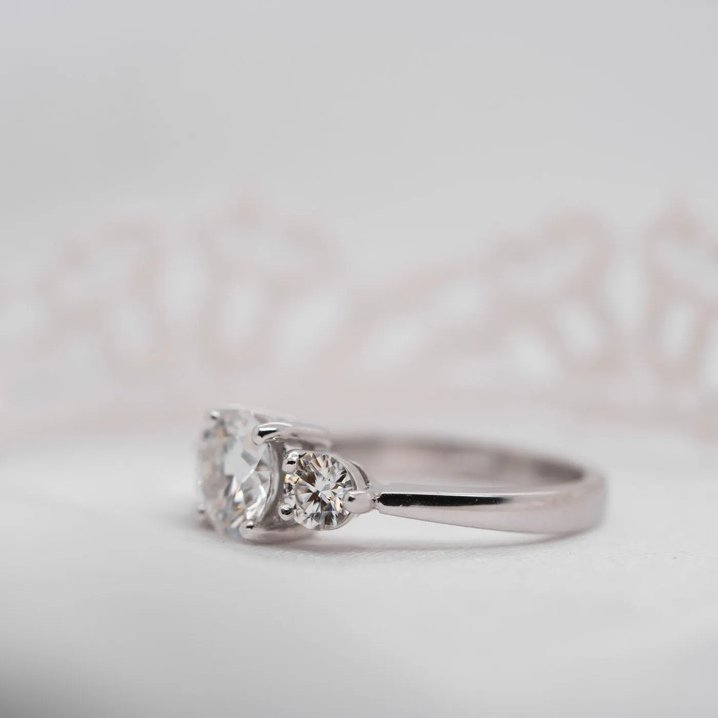 The Adora Ring | Moissanite Classic Round Cut Trilogy Engagement sold by Ethica Diamonds product image thumbnail 3