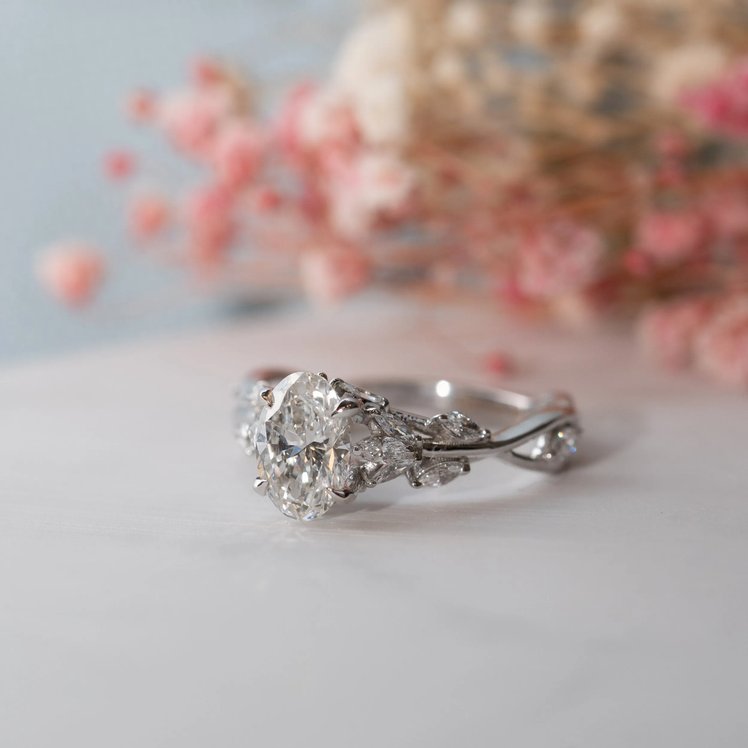 The Eesha Ring | Oval Moissanite & Diamond Accented Trellis Engagement sold by Ethica Diamonds