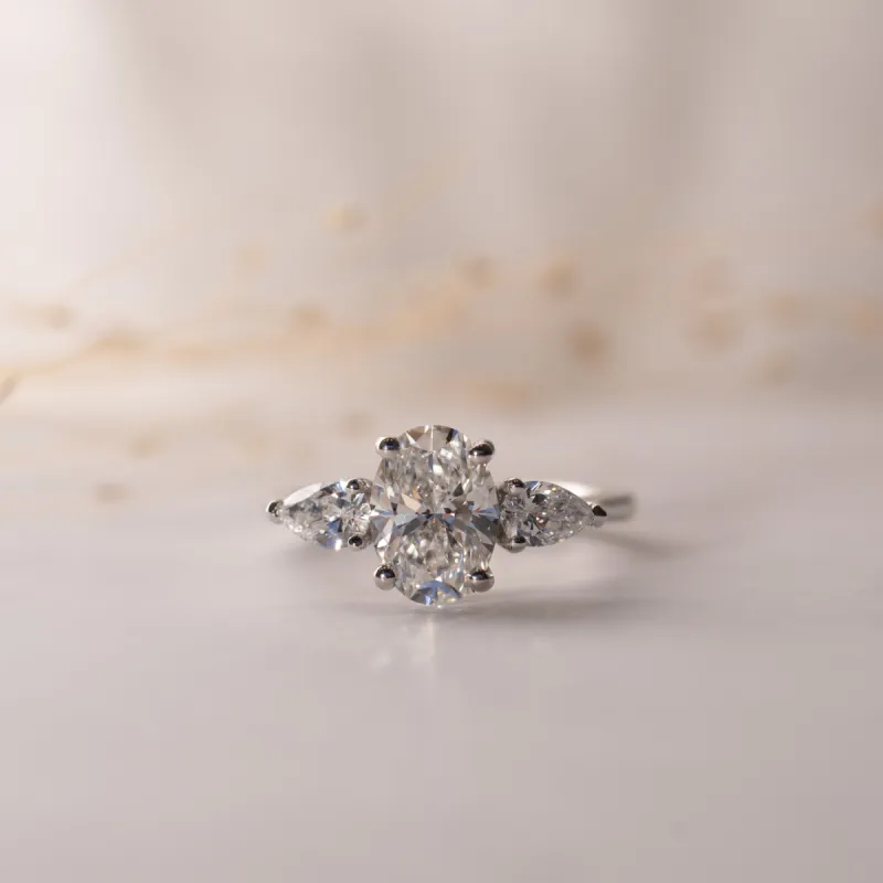 The Nancy Ring | Moissanite Oval & Pear Cut Engagement Trilogy sold by Ethica Diamonds