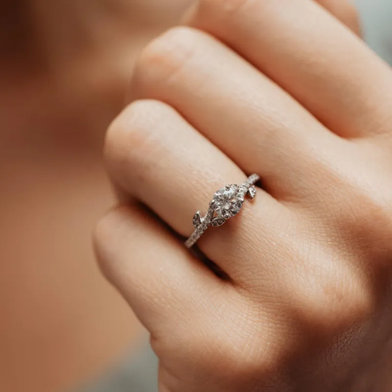 The Azahara Ring | Round Moissanite & Diamond Accented Leaf Vine Engagement sold by Ethica Diamonds