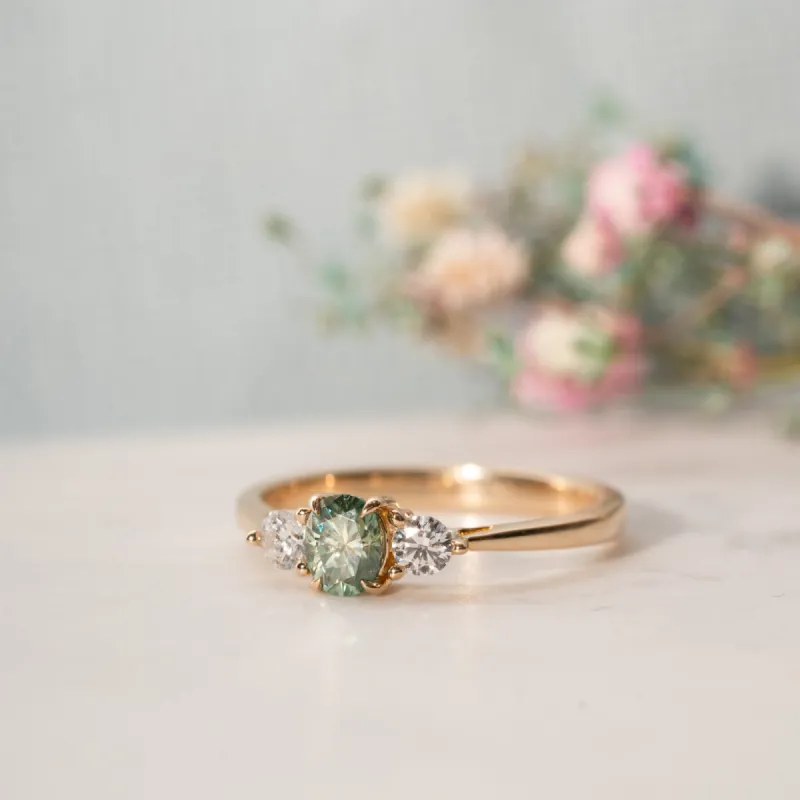 The Tabitha Ring | Seafoam Green Oval Moissanite & Lab Diamond Trilogy sold by Ethica Diamonds