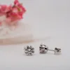The Diandra Earrings | Moissanite Round Six Claw Solitaire Studs sold by Ethica Diamonds