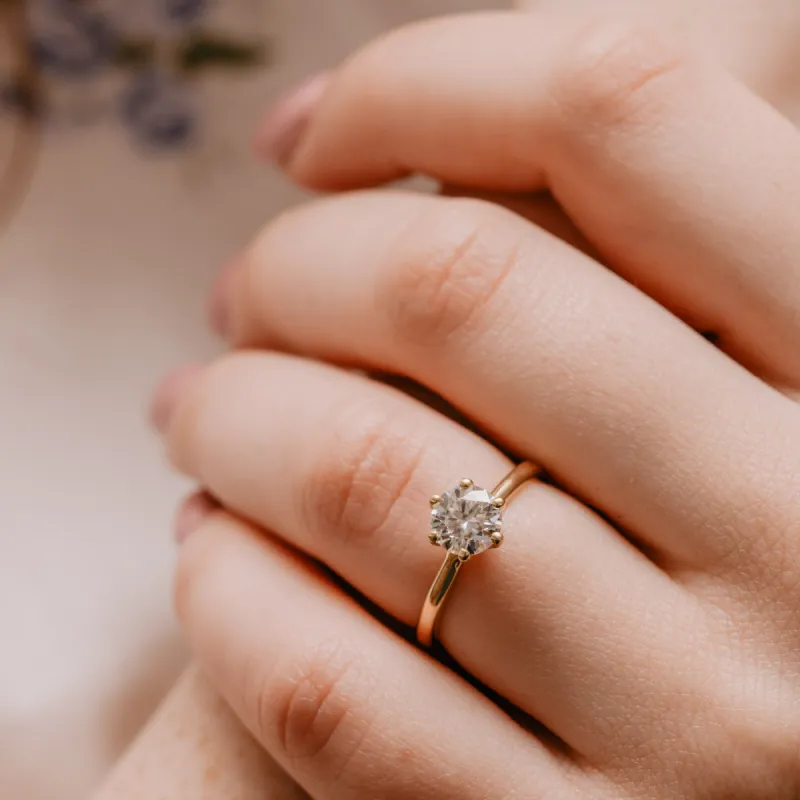 The Marabelle Ring | Round Moissanite Six Claw Engagement Solitaire sold by Ethica Diamonds