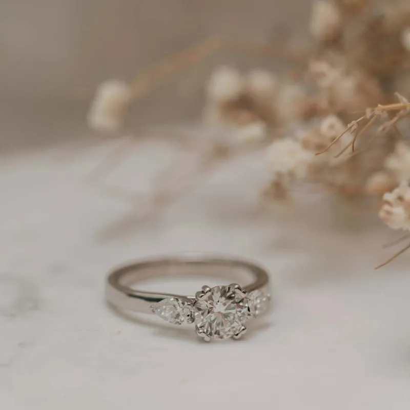 The Madison Ring | Moissanite Round & Pear Engagement Trilogy sold by Ethica Diamonds